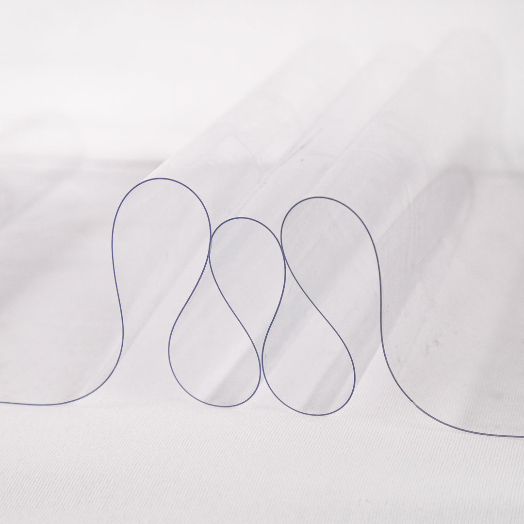 16 gauge clear vinyl fabric draped to show medium-weight transparency | FabricLA