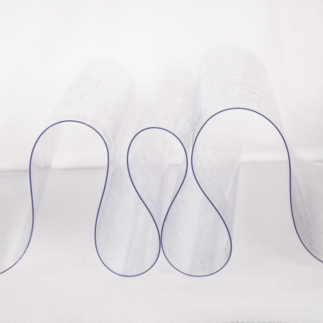 40 gauge clear vinyl fabric draped to show extra heavy transparency | FabricLA