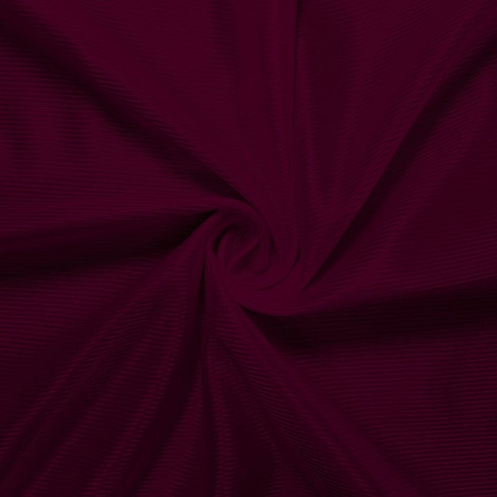Athletic Dazzle Polyester fabric in Maroon, sold by the yard