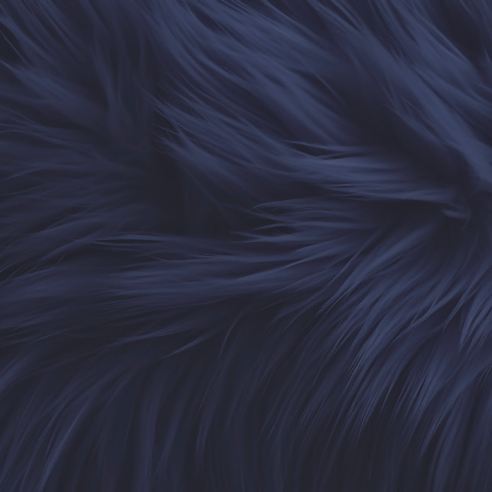 Close-up of bulk faux fur fabric with a shaggy plush long pile texture in dark navy blue.