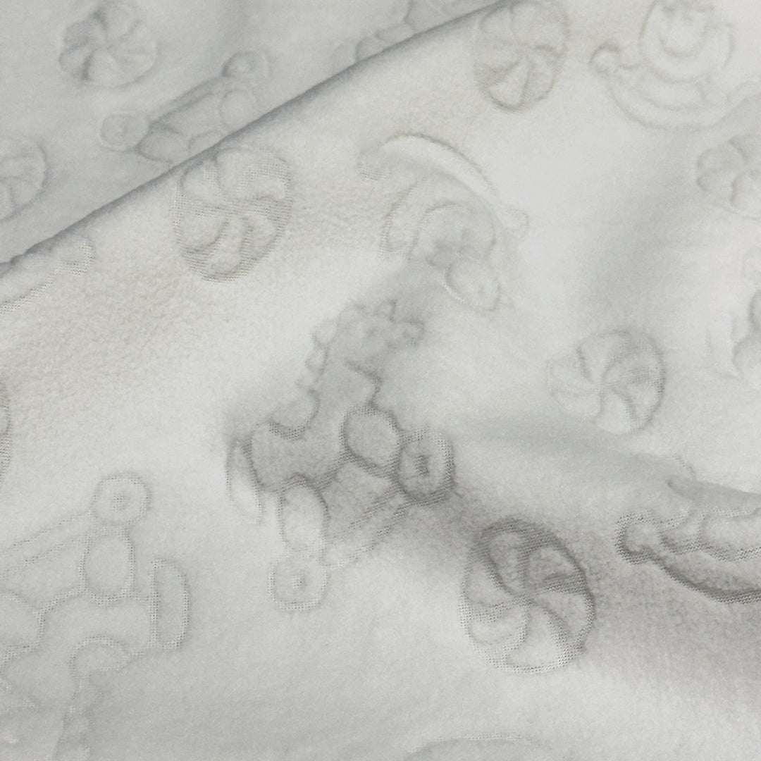 Ivory embossed stretch fleece showing soft drape