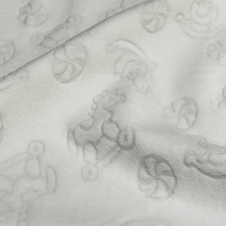 Ivory embossed stretch fleece showing soft drape