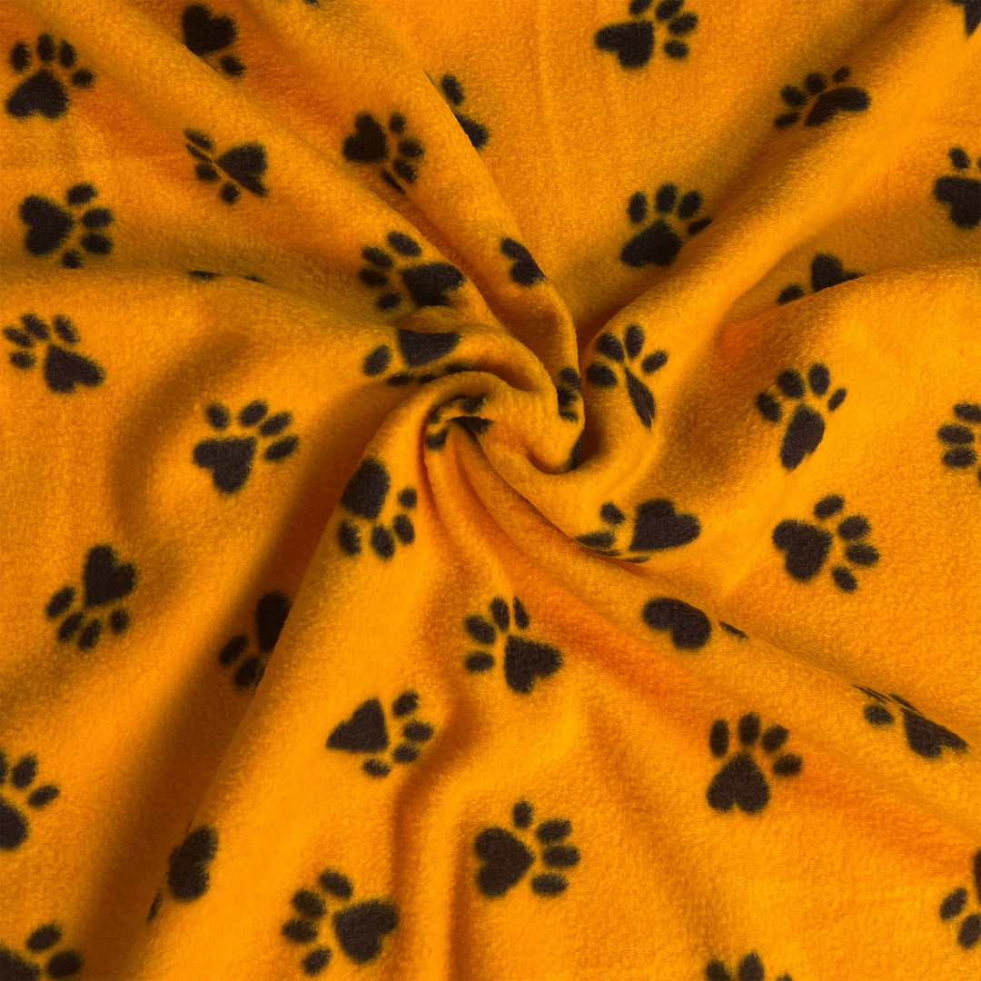 Anti-pill polar fleece fabric by the yard with yellow and black paw print design – 60 inch wide