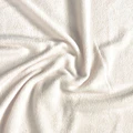 Close-up of beige fabric with a soft texture